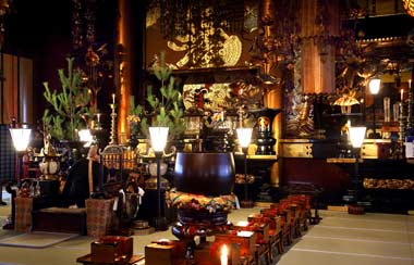 Buddhist priest finishes a ceremony inside the 1,400 year old Zenko-Ji Buddhist Temple