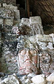 Lourdes Navarrete with co-workers doing conservation work at Kohunlich and these same two masks in 2006